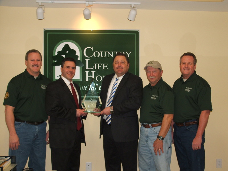Shown with Country Life Homes' 2013 Builder of Integrity Award are (l-r) Ron Littleton, field supervisor for Country Life Homes; Tom McCarthy, business development manager from Quality Builders Warranty Corporation; Michael Fannin, president of Country Life Homes; Wayne Mills, Country Life Homes field supervisor; and Kevin Harding, Country Life Homes director of operations. SOURCE SUBMITTED